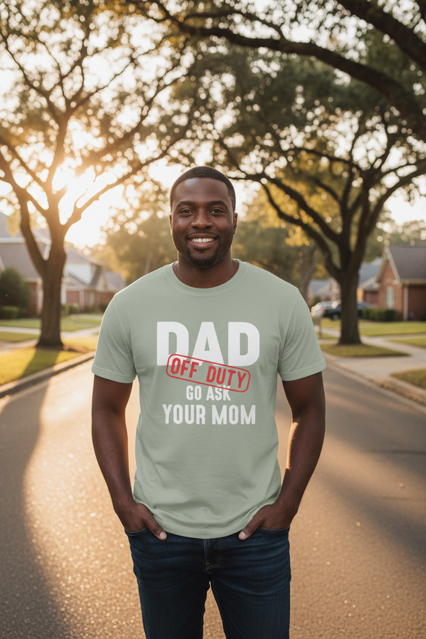 Mixed-race Black dad wearing sage green Dad Off Duty t-shirt on a neighborhood walk