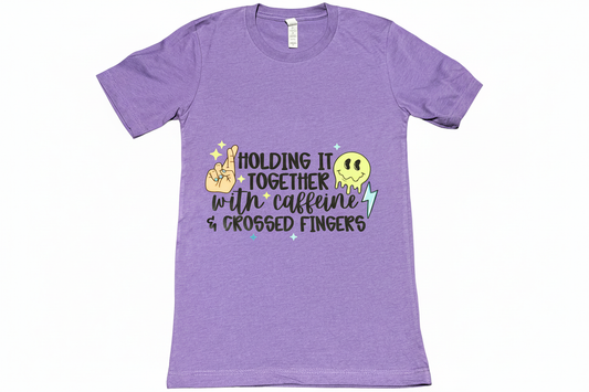Purple t-shirt with caffeine and crossed fingers design