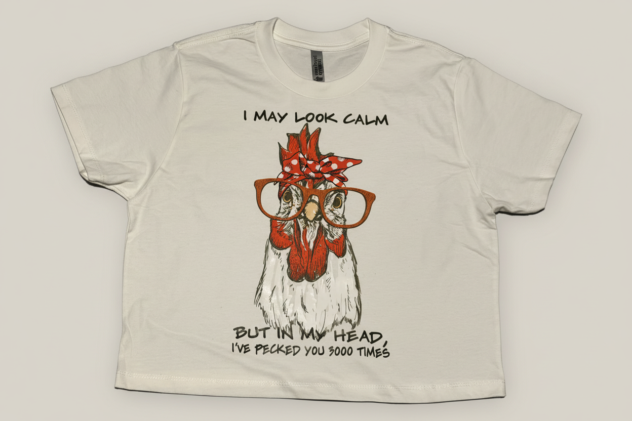 White t-shirt with funny chicken design saying I may look calm