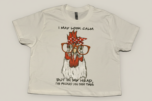 White t-shirt with funny chicken design saying I may look calm